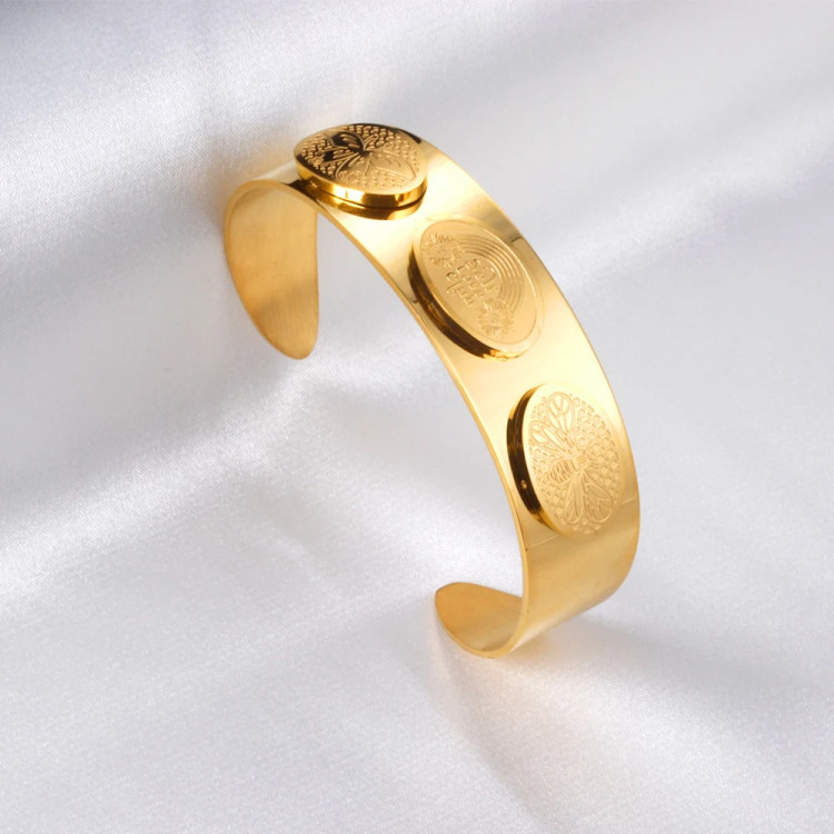 Elegant Gold-Tone Cuff Bracelet with Intricate Design