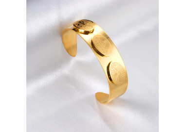 Elegant Gold-Tone Cuff Bracelet with Intricate Design