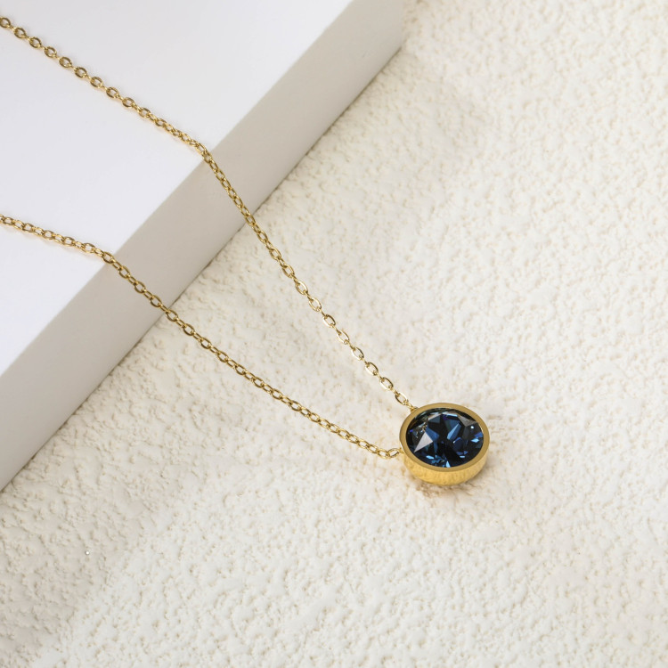 Elegant Gold-Toned Necklace with Deep Blue Pendant