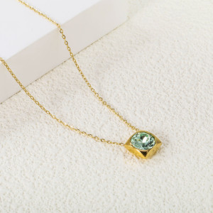 Elegant Gold-Tone Necklace with Unique Green Pendant