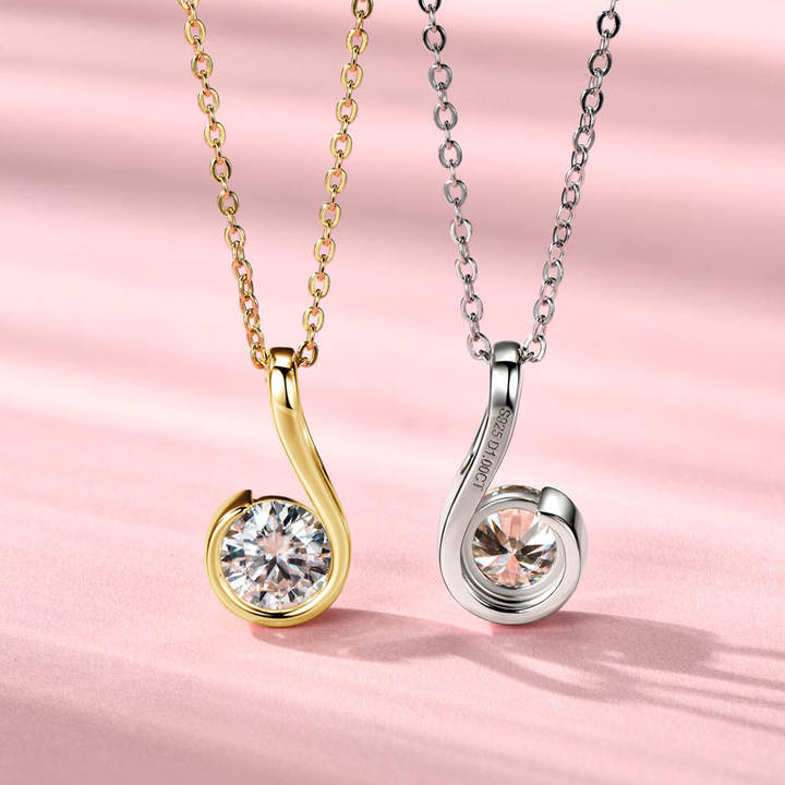 Close-up of round moissanite stone on 925 sterling silver pendant necklace with high shine finish